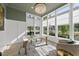 Bright home office with ample natural light, views of the outdoors, and wood floors at 7417 Dover Hills Dr # 73, Wake Forest, NC 27587