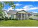 Spacious backyard with lush lawn, mature trees, and a charming screened porch at 79 Heatherwood Dr, Chapel Hill, NC 27516