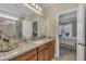 Bathroom features a double vanity with granite countertops, with access to the main bedroom at 79 Heatherwood Dr, Chapel Hill, NC 27516