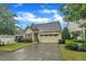Beautiful home with manicured lawn, attached two car garage, and light colored paint at 79 Heatherwood Dr, Chapel Hill, NC 27516