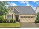 Attractive home with a well-kept lawn, a two-car garage, and delightful curb appeal at 79 Heatherwood Dr, Chapel Hill, NC 27516