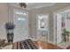 Bright entryway features a decorative rug, white door and a glimpse of the bedroom at 79 Heatherwood Dr, Chapel Hill, NC 27516