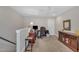 Upstairs home office featuring carpet, ample lighting, and a ceiling fan at 79 Heatherwood Dr, Chapel Hill, NC 27516