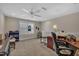 Upstairs home office featuring carpet, ample lighting, and a ceiling fan at 79 Heatherwood Dr, Chapel Hill, NC 27516