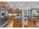 Well-appointed kitchen featuring stainless steel appliances, granite countertops, and wood cabinetry at 79 Heatherwood Dr, Chapel Hill, NC 27516