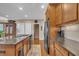 Spacious kitchen showcases an island with sink, stainless steel appliances, and ample cabinet space at 79 Heatherwood Dr, Chapel Hill, NC 27516