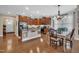 Open-concept kitchen and dining area with granite countertops and stainless steel appliances at 79 Heatherwood Dr, Chapel Hill, NC 27516