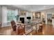 Bright living room featuring neutral tones, hardwood floors, and a fireplace as a focal point at 79 Heatherwood Dr, Chapel Hill, NC 27516