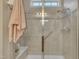 The frameless shower features a bench, handrail, showerhead, and tiled surround at 79 Heatherwood Dr, Chapel Hill, NC 27516