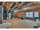 Unfinished room featuring exposed beams, wrapped duct work, and natural light from a window at 79 Heatherwood Dr, Chapel Hill, NC 27516