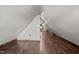 This spacious attic features wood-look floors and modern lighting at 800 Linens St, Graham, NC 27253