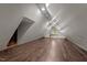 Spacious attic features wood-look floors, a window, and built-in lighting at 800 Linens St, Graham, NC 27253