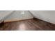 Attic features wood-look floors and a window with natural light at 800 Linens St, Graham, NC 27253