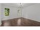 Spacious bedroom features hardwood floors and plenty of natural light at 800 Linens St, Graham, NC 27253