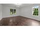 Bright bedroom features hardwood floors, and two windows allowing natural light to brighten the room at 800 Linens St, Graham, NC 27253