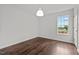 This simple bedroom has wood-look floors and a bright window view at 800 Linens St, Graham, NC 27253
