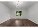 Bedroom features hardwood floors, and a window with a view of the outdoors at 800 Linens St, Graham, NC 27253
