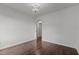 This open bedroom is bright and airy and features a modern chandelier at 800 Linens St, Graham, NC 27253