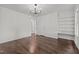 Bedroom features hardwood floors, built-in shelving, and plenty of natural light at 800 Linens St, Graham, NC 27253