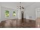 Inviting living room with hardwood floors, bright windows, ceiling fan and neutral paint at 800 Linens St, Graham, NC 27253