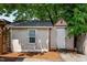View of the property's shed with painted exterior, showing its potential for storage or workshop space at 800 Linens St, Graham, NC 27253
