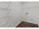 Walk-in closet features built-in metal shelving and wood-look flooring at 800 Linens St, Graham, NC 27253
