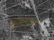 Aerial view depicting a 1.64-acre building lot bordered by trees at 8021 Bud Morris Rd, Wake Forest, NC 27587