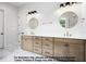Bathroom with double vanities, marble countertops, and modern fixtures at 8021 Bud Morris Rd, Wake Forest, NC 27587