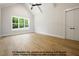 Bright bedroom with a high ceiling, large window, and hardwood floors, creating a serene living space at 8021 Bud Morris Rd, Wake Forest, NC 27587