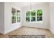 Bright dining room featuring wooden floors and large windows at 8021 Bud Morris Rd, Wake Forest, NC 27587