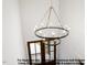 Elegant two-tiered chandelier hangs above the foyer, casting a warm glow on the entryway at 8021 Bud Morris Rd, Wake Forest, NC 27587