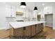 Bright kitchen with white countertops, stainless steel appliances, and a large island at 8021 Bud Morris Rd, Wake Forest, NC 27587