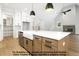 Open kitchen featuring white countertops, stainless steel appliances, and large island with storage at 8021 Bud Morris Rd, Wake Forest, NC 27587
