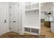 Functional mudroom with built-in storage, bench seating, and coat hooks, designed for organization and convenience at 8021 Bud Morris Rd, Wake Forest, NC 27587