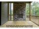 Relaxing outdoor space with stone fireplace and screened porch at 8021 Bud Morris Rd, Wake Forest, NC 27587