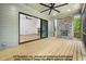 Screened patio features hardwood floors, a stone fireplace, and a view of the backyard at 8021 Bud Morris Rd, Wake Forest, NC 27587