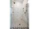 Elegant bathroom with a glass-enclosed shower and marble tile at 8021 Bud Morris Rd, Wake Forest, NC 27587