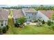 Aerial view of a house with a backyard, patio, fire pit, and well-manicured lawn and landscaping at 805 Narrative Ln, Durham, NC 27703