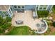 Bird's eye view of the backyard featuring an outdoor kitchen, fire pit, patio, and seating area at 805 Narrative Ln, Durham, NC 27703