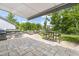 Outdoor patio featuring a built-in grill, seating areas, and lush landscaping at 805 Narrative Ln, Durham, NC 27703