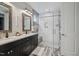 This bathroom is equipped with a dual vanity, granite countertop, and glass enclosed shower at 805 Narrative Ln, Durham, NC 27703