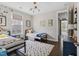 Charming bedroom featuring twin beds, playful decor, and a bright window providing natural light at 805 Narrative Ln, Durham, NC 27703