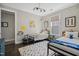' bedroom with twin beds, colorful decor, hardwood floors, and plenty of natural light at 805 Narrative Ln, Durham, NC 27703