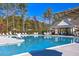 Community pool with chairs and shade umbrellas at 805 Narrative Ln, Durham, NC 27703