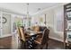Formal dining room with elegant chandelier and seating for six at 805 Narrative Ln, Durham, NC 27703