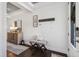 Welcoming foyer features shiplap walls, stylish bench, wood floors, and tasteful decor at 805 Narrative Ln, Durham, NC 27703