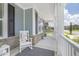 Inviting front porch featuring a rocking chair, stylish rug, and views of the surrounding neighborhood at 805 Narrative Ln, Durham, NC 27703