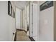 Bright hallway with hardwood floors, neutral walls, and doorways leading to other rooms at 805 Narrative Ln, Durham, NC 27703