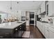 Spacious kitchen featuring a large island, stainless steel appliances, and a seamless transition to the dining area at 805 Narrative Ln, Durham, NC 27703