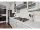Modern kitchen featuring light gray cabinets, stainless steel appliances, and stylish backsplash at 805 Narrative Ln, Durham, NC 27703